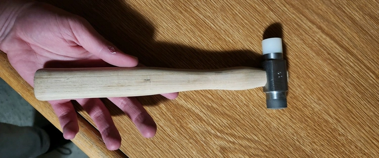 Photo of two-faced machinist's hammer manufactured to tight tolerances for E4.