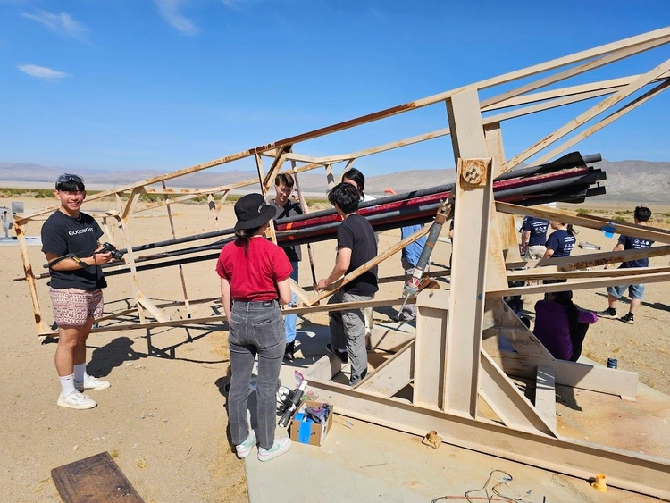 Photo of team setting up Gladius II on the launch rails.
