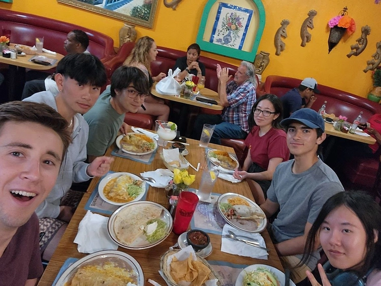 Group photo of team at dinner in California City.