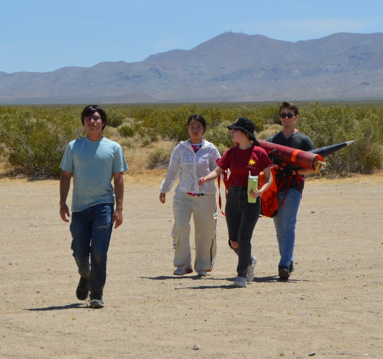 Photo of team carrying back Gladius II after touchdown.