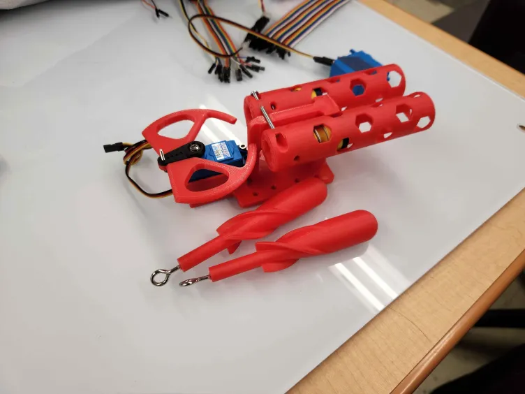 Photo of 3D-printed torpedo launcher assembly and torpedoes.