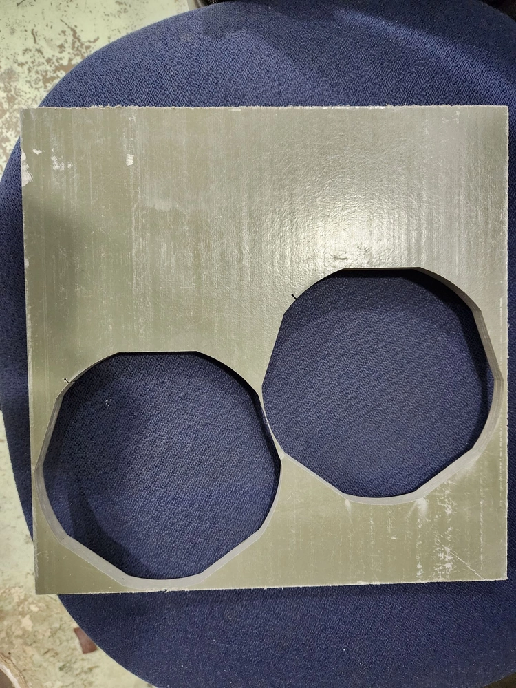 Photo of fiberglass centering rings waterjetted to tight tolerances.