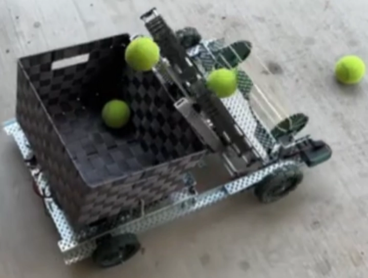 Photo of Alhambra High School Robotics Club robot retreiving tennis balls.