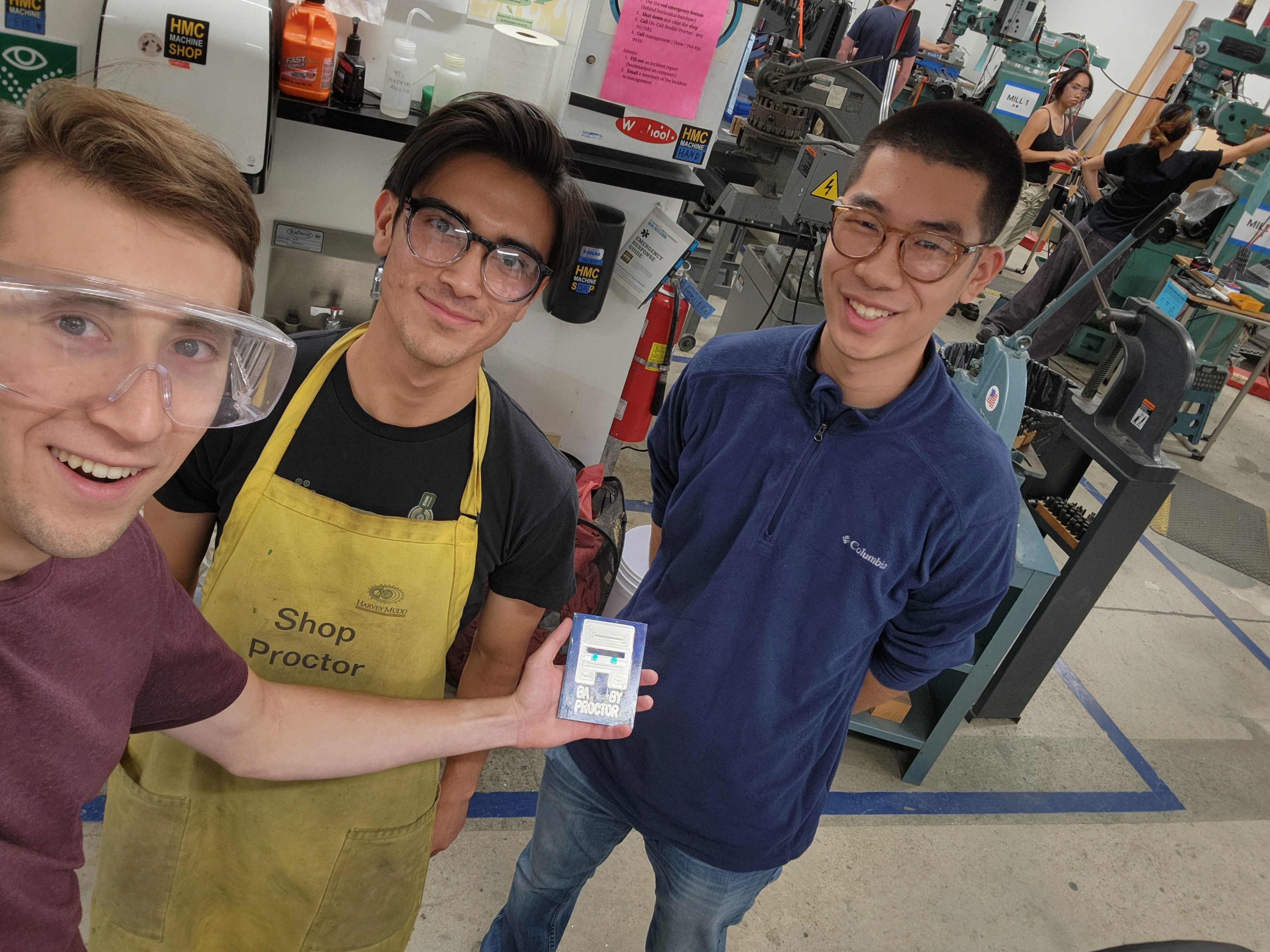 Photo of Jacob, Sebastian, and Christian with their Villager CNC engraving.